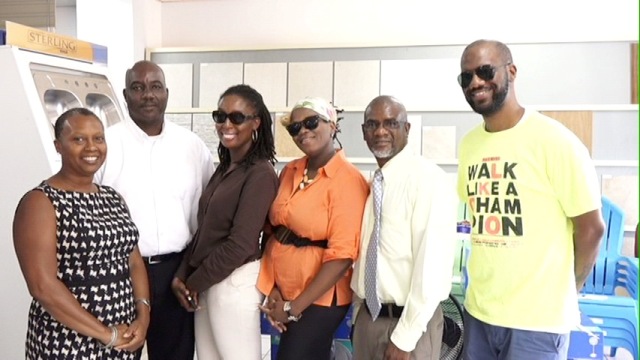 (L-R) Chairperson of Culturama 41 Deborah Tyrell, General Manager of S. L Horsford Nevis Centre Oscar Walters, Royal Rampage representatives Seba Jones and Rifka Maycock-Harding, Retail Manager of S. L Horsford Nevis Centre and Kore Entertainment representative Cory Tyson at the handing ceremony of sponsorship cheques to Culturama 41 participants on July 21, 2015, at the S. L Horsford Nevis Centre located at Marian Heights, Nevis